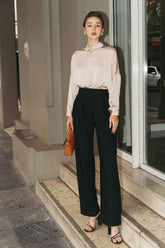 Tailored silk wide-leg pants with high-rise waist and pleated front for elegant drape